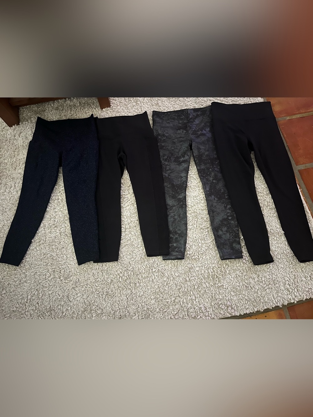 Seven pair Athleta leggings, Elation and Salutation styles. Size medium